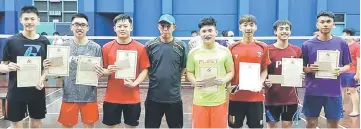  ??  ?? PBM owner and chief coach Dominic Lim (fifth right) with his stable of shuttlers.