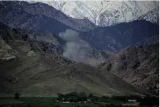  ??  ?? LEFT: Smoke rises after a US air strike on IS positions in Nangarhar province. BELOW: A US MOAB bomb.