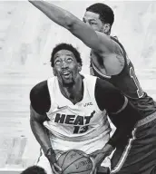  ?? Charles Krupa / Associated Press ?? Heat center Bam Adebayo looks to shoot while the Celtics’ Tristan Thompson defends.