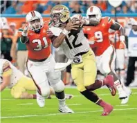  ?? MIKE EHRMANN/GETTY IMAGES FILE ?? Deondre Francois of the Florida State Seminoles looks to pass during a 2016 game against the Miami Hurricanes. Just two weeks after its 2017 season opener, Miami faces FSU in Tallahasse­e.