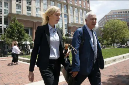  ?? MANUEL BALCE CENETA — THE ASSOCIATED PRESS ?? Paul Manafort’s former bookkeeper Heather Washkuhn, left, walks to the Alexandria Federal Courthouse in Alexandria, Va., Thursday to testify at President Donald Trump’s former campaign chairman Manafort’s tax evasion and bank fraud trial. Washkuhn...