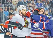  ?? BRUCE BENNETT / AGENCE FRANCE-PRESSE ?? Zack Smith of the Ottawa Senators mixes it up with Brady Skjei of the New York Rangers during Game 4 of their NHL Eastern Conference semifinal at Madison Square Garden on Thursday.