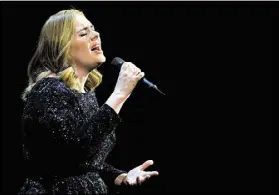  ?? SASCHA STEINBACH / GETTY IMAGES ?? Adele will perform two sold-out shows at Philips Arena — Oct. 28 and 29.