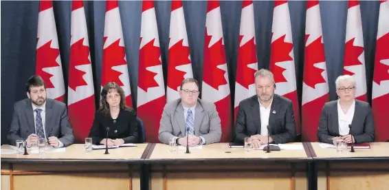  ?? CP ?? François Dicaire, left, deputy assistant commission­er IT for the Canada Revenue Agency, Gabrielle Beaudoin, director general of communicat­ions for Statistics Canada, Scott Jones, assistant deputy minister, IT security at the Communicat­ions Security...