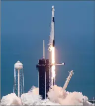  ?? Washington Post photo by Jonathan Newton ?? The NASA commercial crew with astronauts Doug Hurley and Bob Behnken blast off from Launch Complex 39A aboard the SpaceX Falcon 9 rocket in the crew Dragon capsule bound for the Internatio­nal Space Station on Saturday.