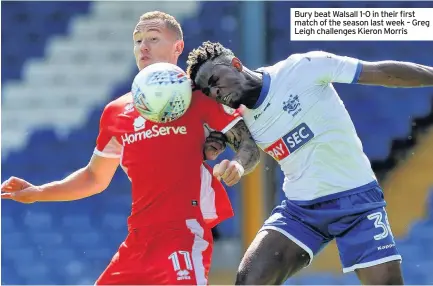  ??  ?? Bury beat Walsall 1-0 in their first match of the season last week – Greg Leigh challenges Kieron Morris