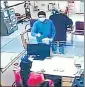  ??  ?? GONE IN 3 MINUTES: CCTV footage showing the robbers pointing a gun at a bank employee, and later leaving the premises.