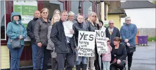  ??  ?? n PROTEST: Residents make their feelings clear about plans for the Tommy Flynns pub. Right, what the developmen­t could look like