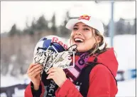  ?? Kelsey Brunner / Associated Press ?? X Games rookie Eileen Gu, of China, holds her two gold medals and one bronze after winning the women’s ski slopestyle final on Saturday in Aspen, Colo.