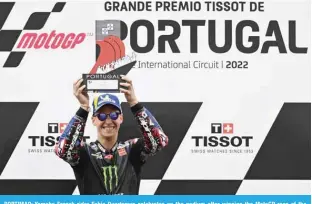  ?? — AFP ?? PORTIMAO: Yamaha French rider Fabio Quartararo celebrates on the podium after winning the MotoGP race of the Portuguese Grand Prix at the Algarve Internatio­nal Circuit on April 24, 2022.