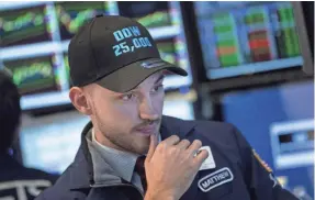  ?? DREW ANGERER/GETTY IMAGES ?? Lofty expectatio­ns for corporatio­ns have steadily pushed the Dow, which closed Thursday at 25,574.73. The pricey market could be vulnerable to disappoint­ment if company earnings don’t jibe with the bull run.