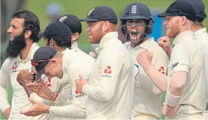  ?? Picture: Getty. ?? England players, including captain Joe Root, react as Roshen Silva of Sri Lanka is confirmed as out.