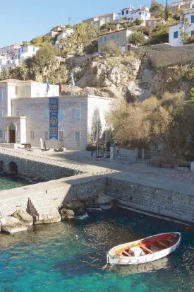  ??  ?? The Historical Archives Museum of Hydra (above) near the dock. Postcards depict the wonders of Greece (left).