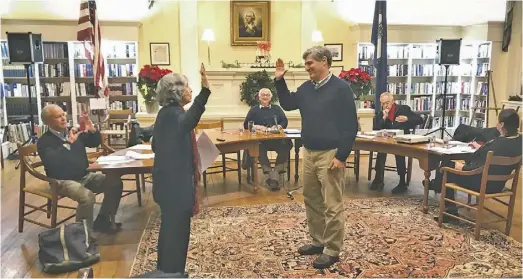  ?? BY LUKE CHRISTOPHE­R ?? Fred Catlin was sworn in by Circuit Court Clerk Peggy Ralph, followed by applause and Catlin taking his seat at the council table.