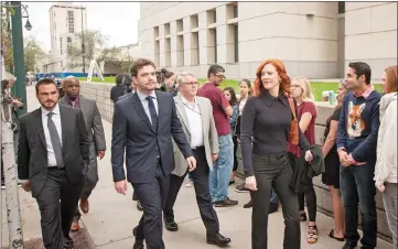  ??  ?? Swift’s brother Austin, centre left, and publicist Tree Payne, centre right, arrive for the civil case for Taylor Swift vs David Mueller at the Alfred A. Arraj Courthouse on Thursday in Denver, Colorado. (Below) A message with Swift’s song lyrics is...