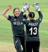  ??  ?? Holly Huddleston is congratula­ted by wicketkeep­er Rachel Priest for one of her five wickets against Sri Lanka.