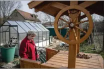  ?? AKOS STILLER — THE NEW YORK TIMES ?? Eniko Pasztor, a pensioner and opponent of the future CATL battery factory, worries what might happen to the well water in her garden.