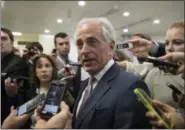  ?? J. SCOTT APPLEWHITE — THE ASSOCIATED PRESS ?? Senate Foreign Relations Committee Chairman Sen. Bob Corker, R-Tenn. is surrounded by reporters on Capitol Hill in Washington.