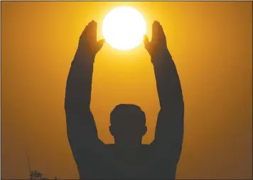  ??  ?? The sun sets over a statue of Gagarin at the Baikonur cosmodrome in Kazakhstan. (AP/Dmitri Lovetsky)