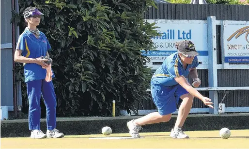  ?? PHOTO: WAYNE PARSON ?? Eye on the prize . . . Sarah Scott delivers a bowl in the final of the women's open singles at Outram Bowling Club on Sunday as her opponent, Hilda Bennett, looks on.