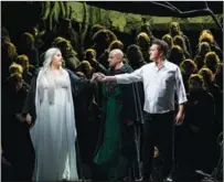  ?? ?? From left: Tamara Wilson as Elsa, Gunther Groissbock (middle) as King Heinrich, and Piotr Beczała in the title role of the opera; Groissbock as King Heinrich.