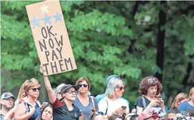  ?? VINCENT CARCHIETTA/USA TODAY SPORTS ?? A fan holds a sign during the ceremony in New York supporting the U.S. women winning the 2019 World Cup.