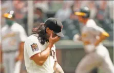  ?? Scott Strazzante / The Chronicle ?? The Giants’ Dereck Rodriguez gave up a threerun homer to Stephen Piscotty (background) in the A’s ninerun fifth inning.