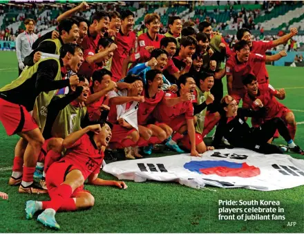  ?? AFP ?? Pride: South Korea players celebrate in front of jubilant fans