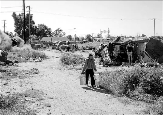  ?? PHOTOS BY JASON HENRY / THE NEW YORK TIMES ?? Long plagued by poverty and desperatio­n, Stockton is hoping to become an exhibition for the simple but unorthodox experiment of universal basic income, giving $500 a month in donated cash to about 100 local families, no strings attached.