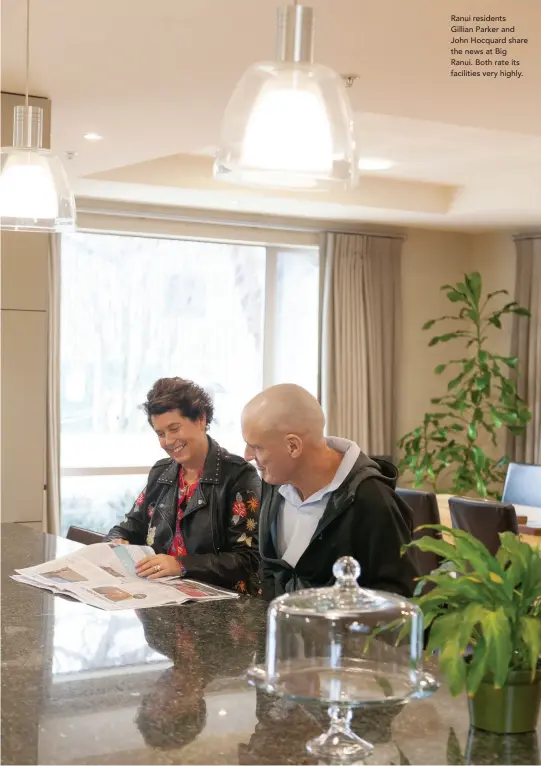  ??  ?? Ranui residents Gillian Parker and John Hocquard share the news at Big Ranui. Both rate its facilities very highly.