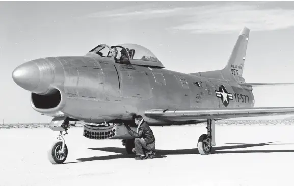  ??  ?? Starting life as the YF-95A #50-477, the prototype all-weather Sabre, later re-designated as the YF-86D, is seen here during its testing at Edwards AFB in 1950. (Photo courtesy of Stan Piet)