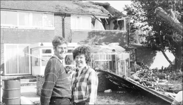  ?? ?? A couple survey the damage at a home in Kennington