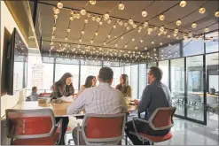  ?? Diageo North America / Contribute­d photo ?? Diageo employees at the company’s new headquarte­rs office at 3 World Trade Center in New York City.