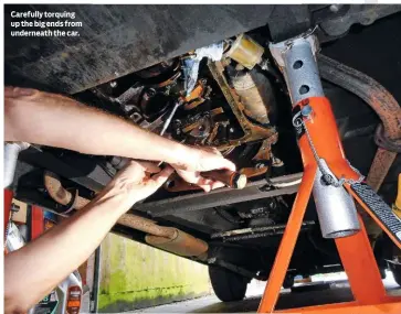  ??  ?? Carefully torquing up the big ends from underneath the car.