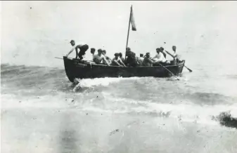  ?? Orleans Historical Society ?? Survivors of a German submarine attack arrive in a lifeboat in Orleans, Mass., on July 21, 1918. The town was the only place on U.S. soil to receive enemy gunfire during World War I.