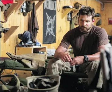  ?? KEITH BERNSTEIN / WARNER BROS. PICTURES / THE ASSOCIATED PRESS ?? Bradley Cooper appears in a scene from American Sniper, which critics argue is an incomplete portrait of the Iraq War.
