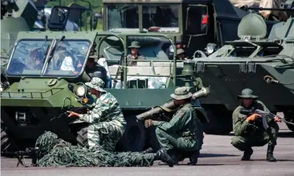  ?? Photograph: Johnny Parra/EPA ?? Members of the Bolivarian Armed Forces of Venezuela take part in military exercises on the Colombian border in 2019.