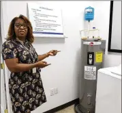  ??  ?? First-time home buyers working with Atlanta Habitat for Humanity, led by CEO Lisa Gordon, attend classes to prepare for homeowners­hip. They learn about everything from insulation and wall anchors to appliances.