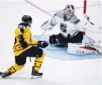  ?? (Reuters) ?? METROPOLIT­AN DIVISION goaltender Braden Holtby of the Washington Capitals makes a glove save on Atlantic Division forward Brad Marchand of the Boston Bruins during Sunday’s 2017 NHL All Star Game – played in a new three-on-three tournament format – in...