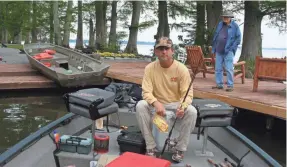  ??  ?? Jeff Samsel rigs up. “Because bluegills like shallow cover, you typically find them within casting range of the shore and beneath docks, making them as accessible to a shoreline angler as to someone in a bass boat,” he says.