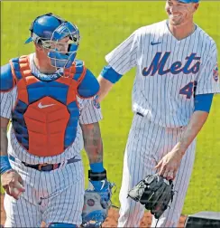  ?? Paul J. Bereswill ?? SMILE HIGH: Jacob deGrom is all smiles while walking off the field with Wilson Ramos after the seventh inning of the Mets’ 14-1 victory over the Phillies on Sunday.