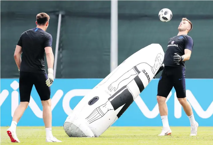  ?? — GETTY IMAGES ?? Jack Butland and his England teammates train on Friday in St. Petersburg ahead of Monday’s Group G encounter with underdog Tunisia.