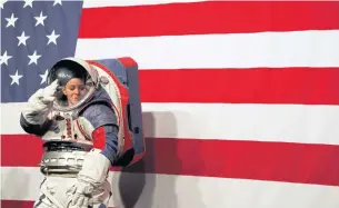  ??  ?? Advanced Space Suit Engineer at Nasa Kristine Davis wears the xEMU prototype spacesuit for the next astronaut to the moon by 2024, during its presentati­on at Nasa headquarte­rs in Washington, DC on Tuesday.