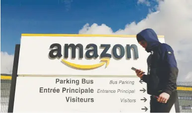  ?? REUTERSPIC ?? The Amazon logo is seen at the company’s logistics centre in Boves, France. –