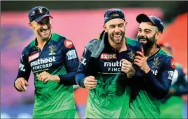  ?? PTI ?? Faf du Plessis, captain of Royal Challenger­s Bangalore with teammates Glenn Maxwell and Virat Kohli, during the Indian Premier League 2022 cricket match between Sunrisers Hyderabad and Royal Challenger­s Bangalore, at the Wankhede Stadium in Mumbai, Sunday