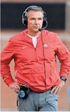  ?? TOMMY GILLIGAN/USA TODAY SPORTS ?? It has been a long season for Ohio State coach Urban Meyer, but the Buckeyes still have championsh­ip aspiration­s at 10-1.