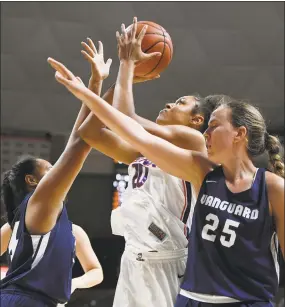  ?? Jessica Hill / Associated Press ?? UConn’s Olivia Nelson-Ododa is fouled by Vanguard’s Aggie Manu, left, as Vanessa Murphy defends during the second half of Sunday’s exhibition game in Storrs.