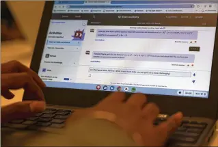  ?? ?? A student at Khan Lab School uses Khanmigo, a new AI tutoring bot that can help students work through math problems and other subjects. The chatbot — designed specifical­ly for school use — is being pilot tested in a handful of states, including Indiana and New Jersey.