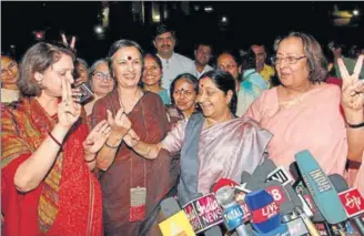  ?? PTI FILE PHOTO ?? Leader of Opposition in Lok Sabha Sushma Swaraj, BJP leader Najma Heptullah and CPI(M) leader Brinda Karat show victory sign as they celebrate the passage of Women's Reservatio­n Bill in Rajya Sabha in March 2010.