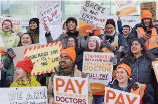  ?? ?? Protest over pay: Junior doctors on a picket line in London this week